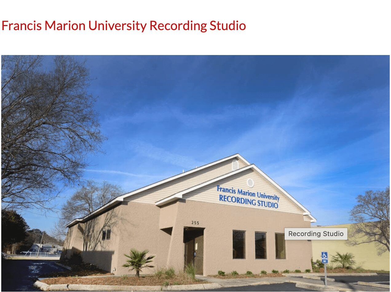 Building with sign for Francis Marion University Recording Studio under a blue sky.