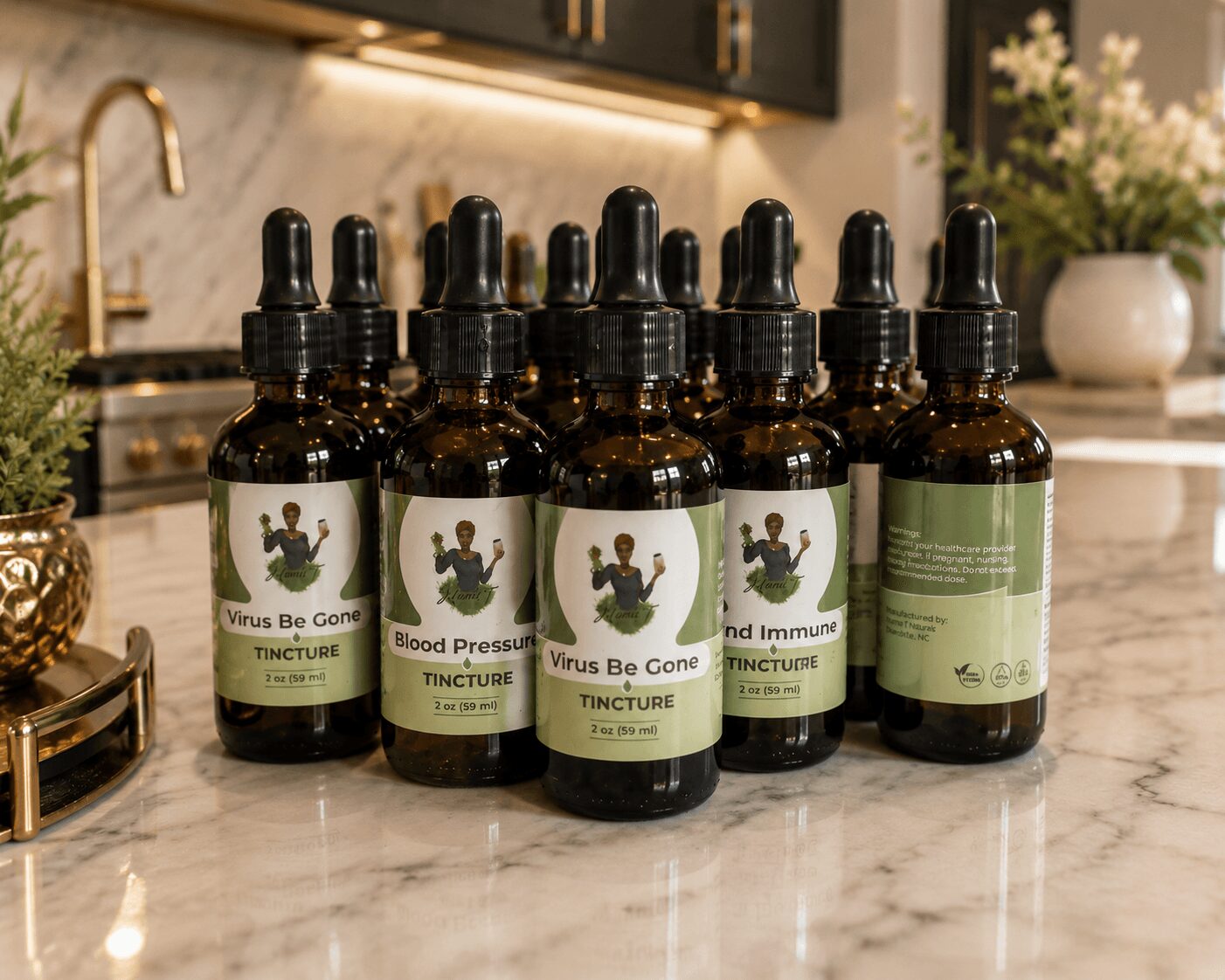 Seven small brown bottles with dropper caps on a marble countertop in a kitchen, with plants and a sink in the background.
