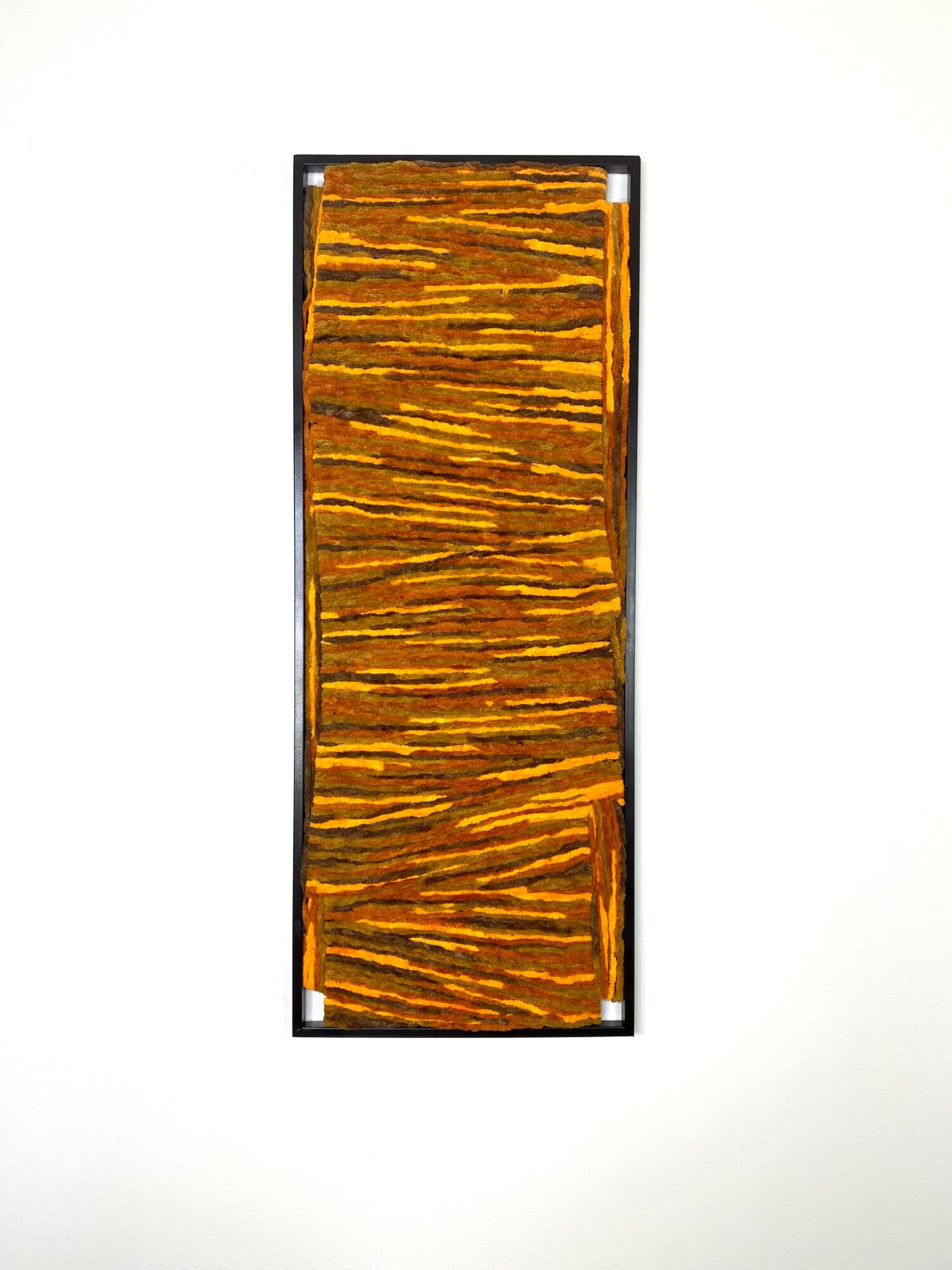 Rectangular wooden object with horizontal slats, framed in black, on a white background.
