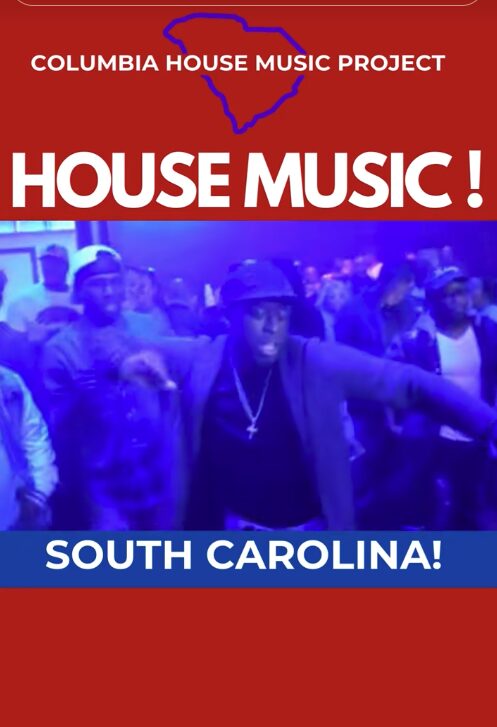 Group of people dancing at a music event with blue lighting, wearing casual clothing and hats.
