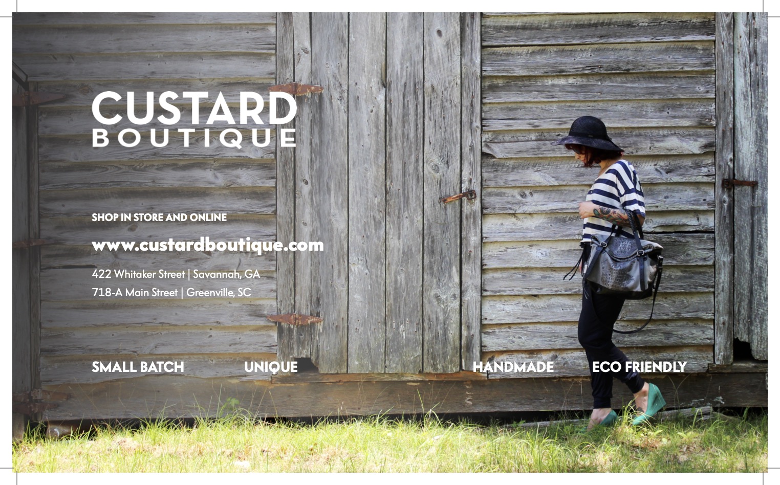 Person standing in front of wooden wall with text about Custard Boutique, wearing striped shirt, hat, and carrying a bag.