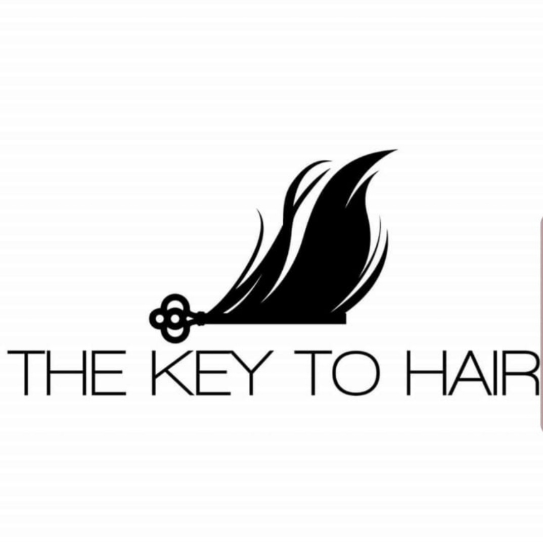 A key with hair strands attached, and the text 'THE KEY TO HAIR' below, in black on white background.