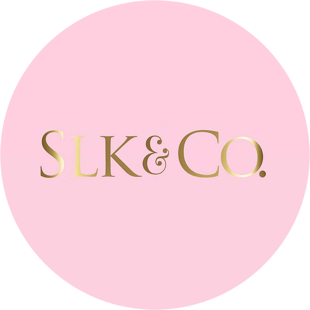 Pink circle with gold text reading 'SLK & Co.' inside a black background.